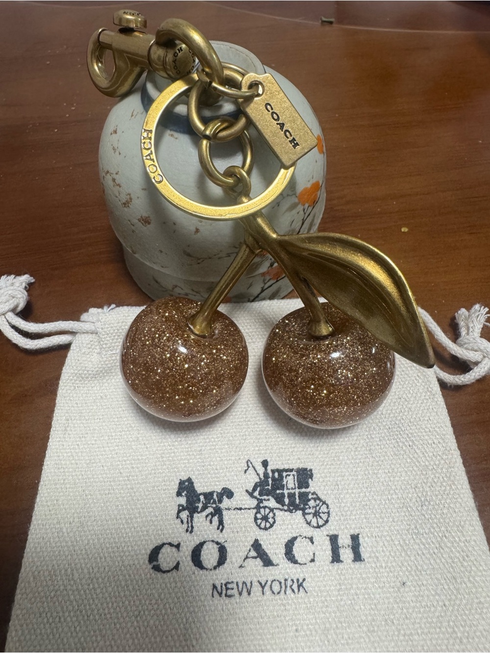 Coach Gold-Tone Glitter Brown Cherry Key Charm